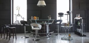 Modern dining area with sleek black and white chairs around a glass table.
